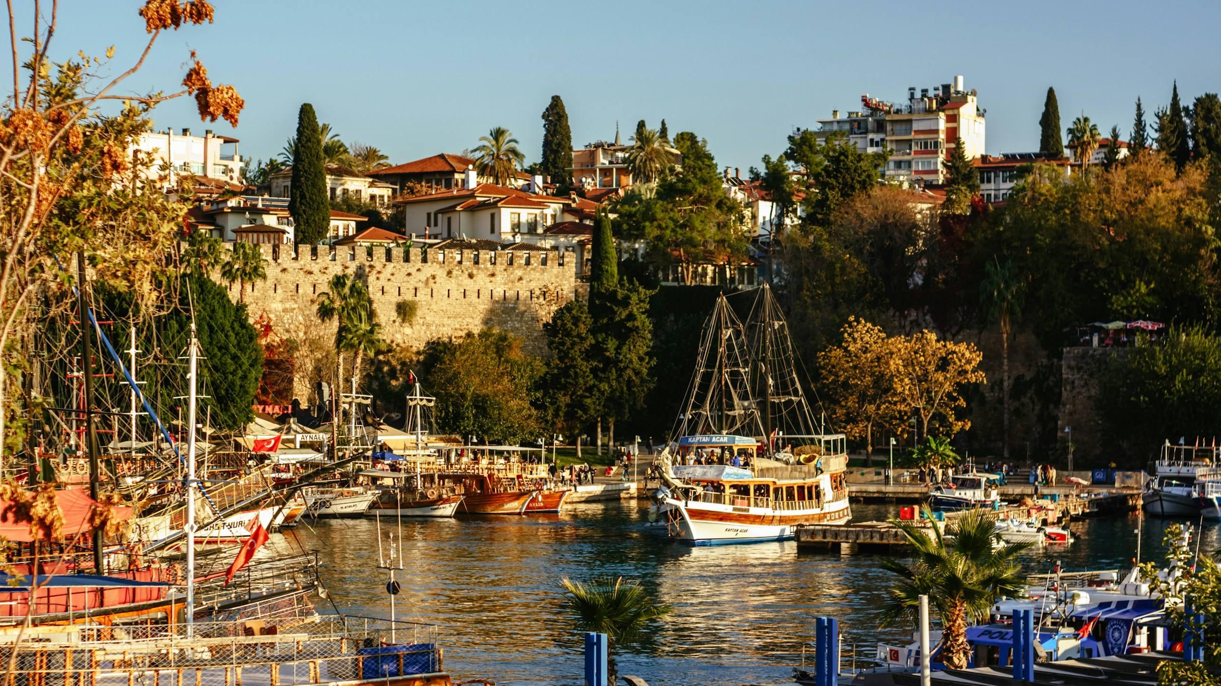 Wooden boats in the old harbour below the walls of Kaleiçi, Antalya's old town