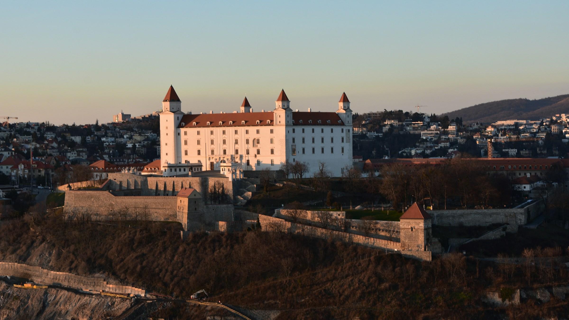 Bratislava Castle at dusk, above the Danube