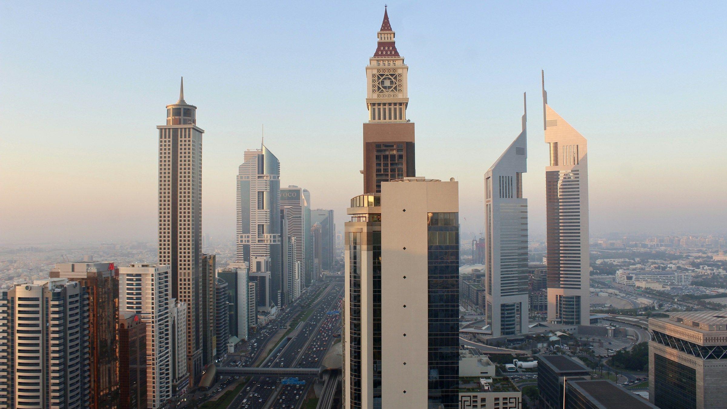 Office and hotel towers along Sheikh Zayed Road in Dubai at golden hour