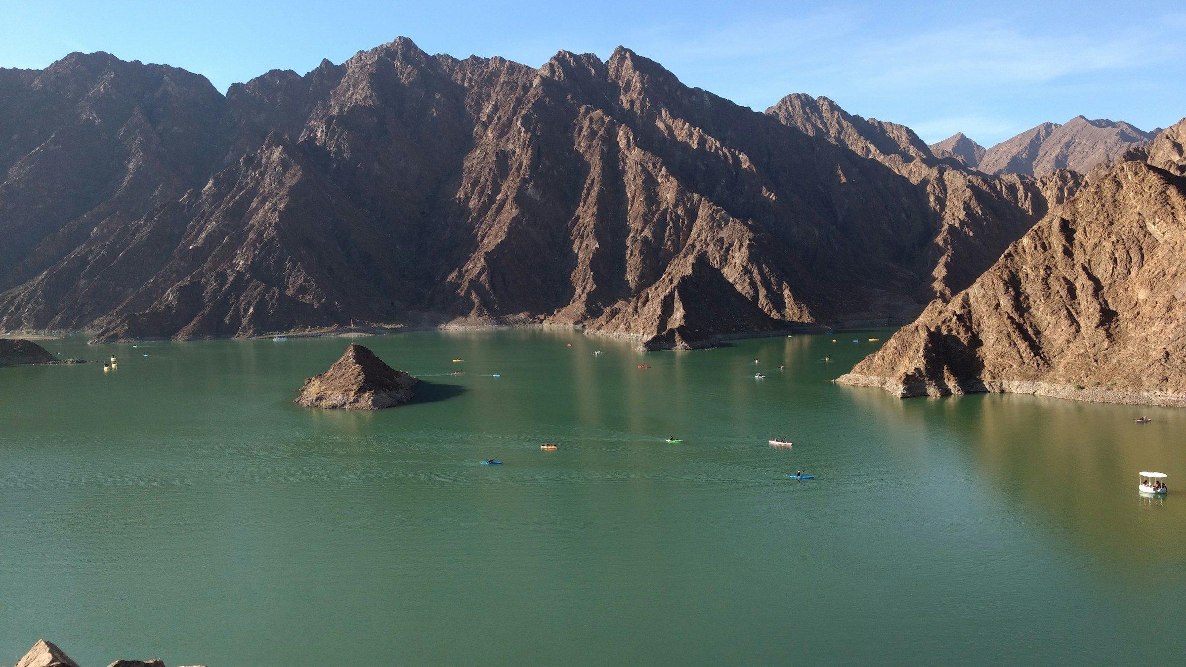 Hatta Dam's green lake among the Hajar Mountains