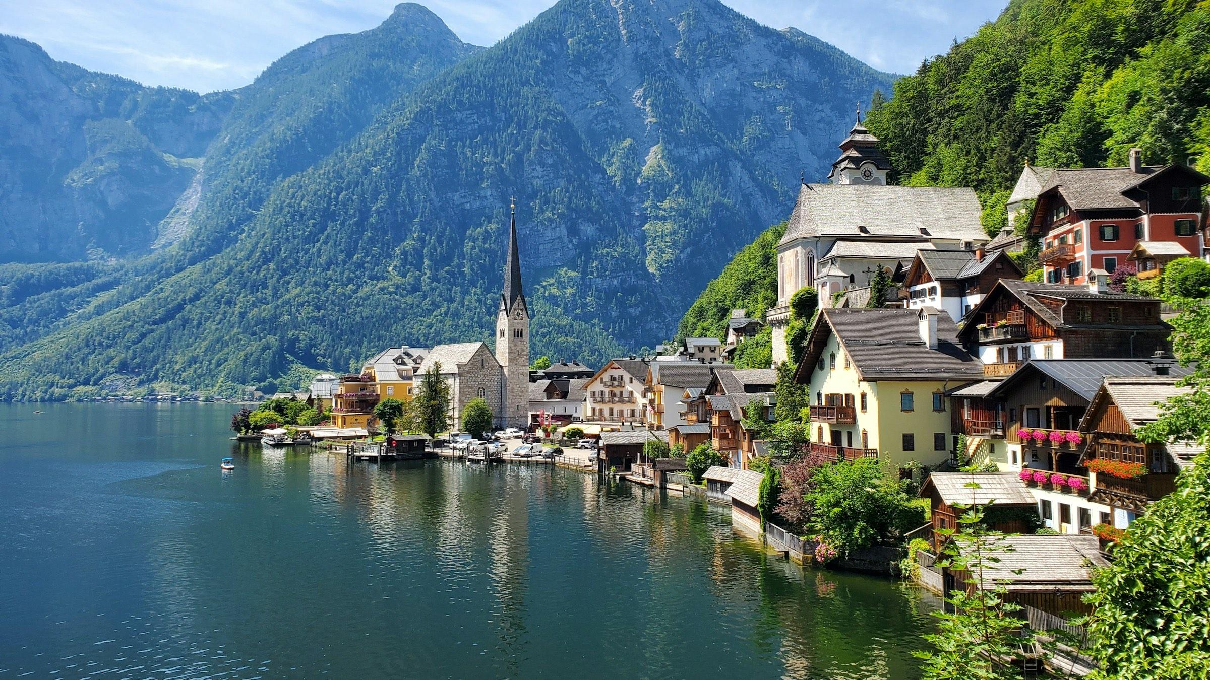 Hallstatt's lakeside houses and church below the Alps