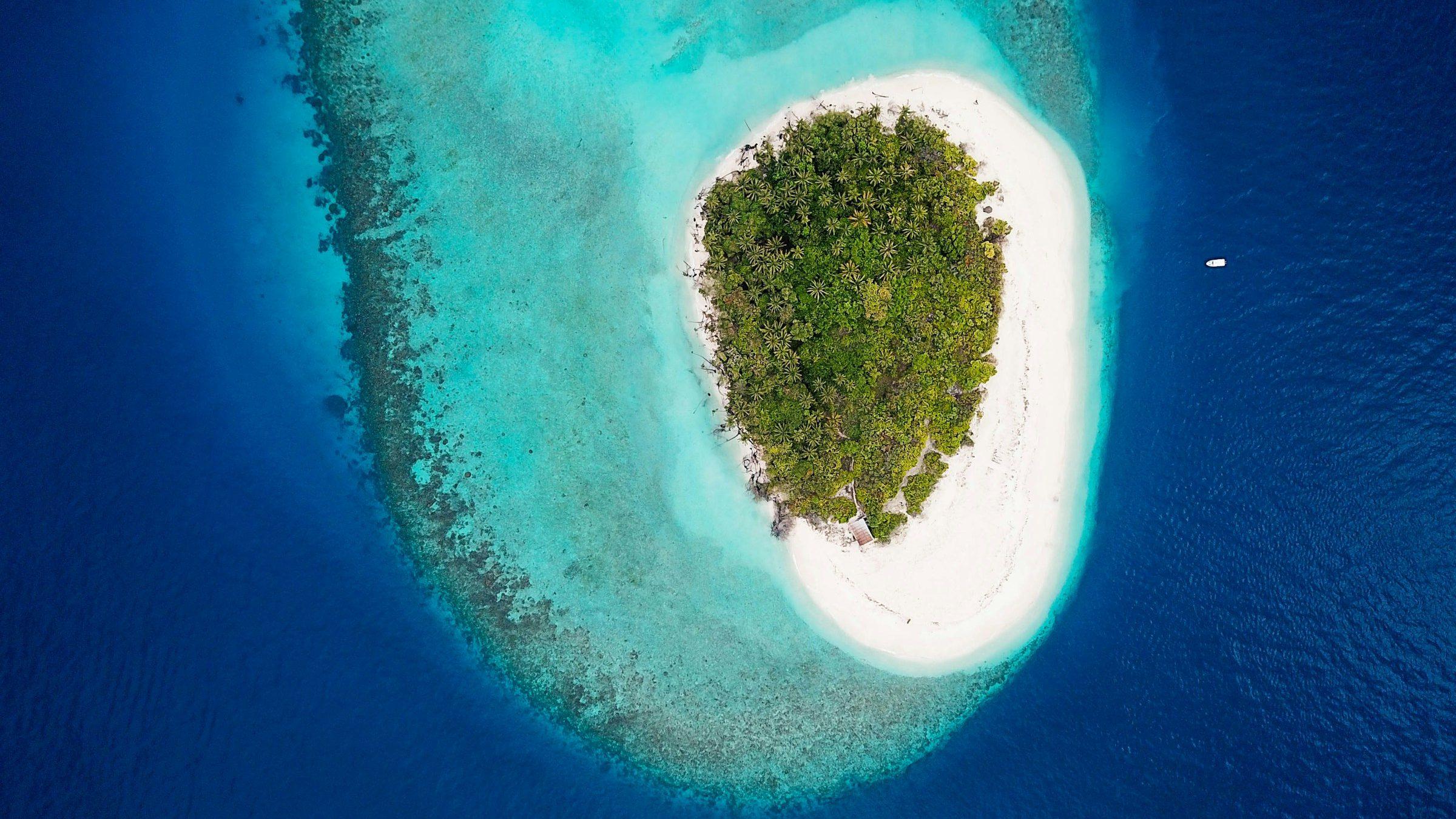 An uninhabited island and its reef in Baa Atoll, Maldives