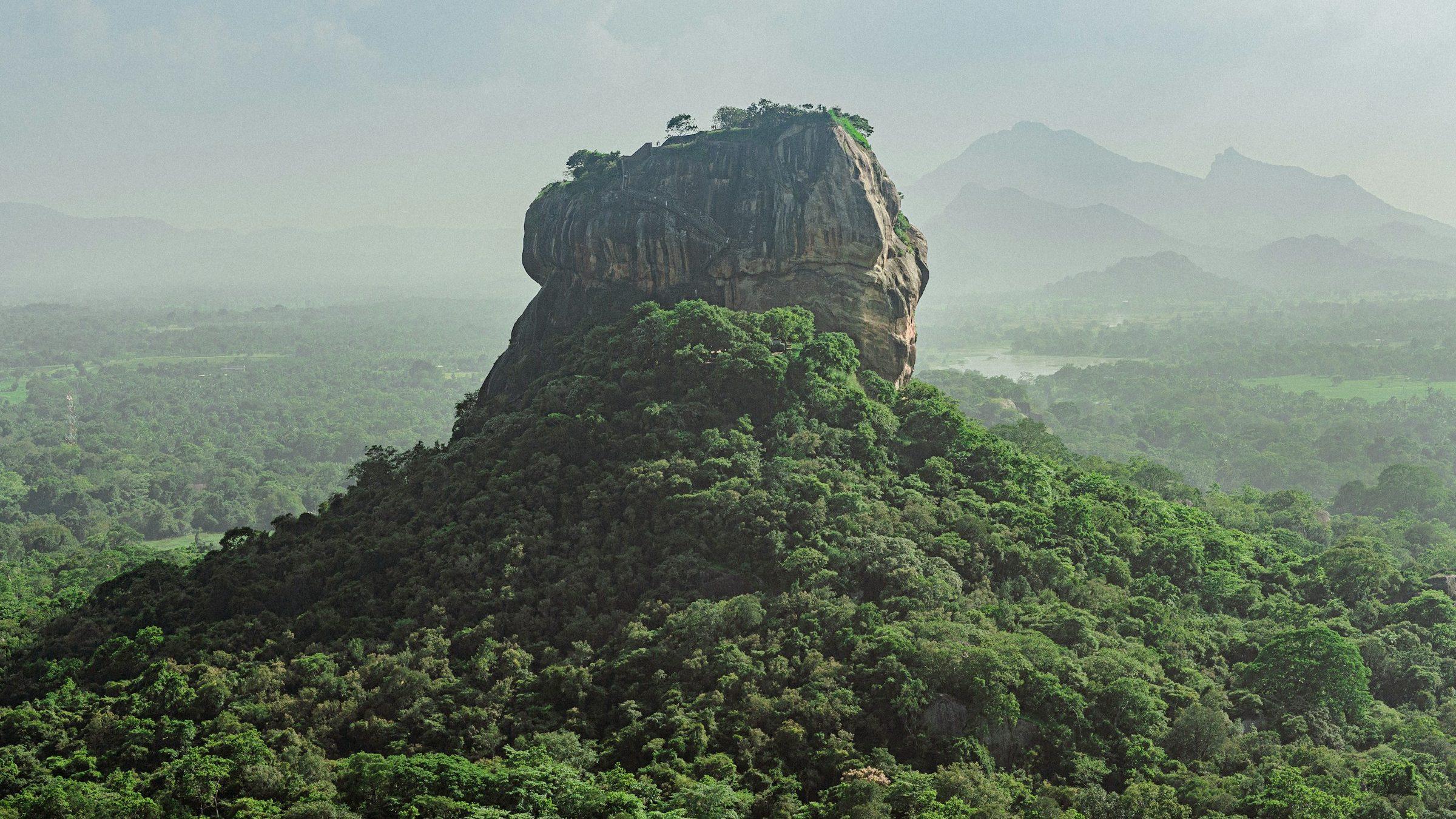 Sigiriya rock fortress above the forest, seen from Pidurangala, Sri Lanka