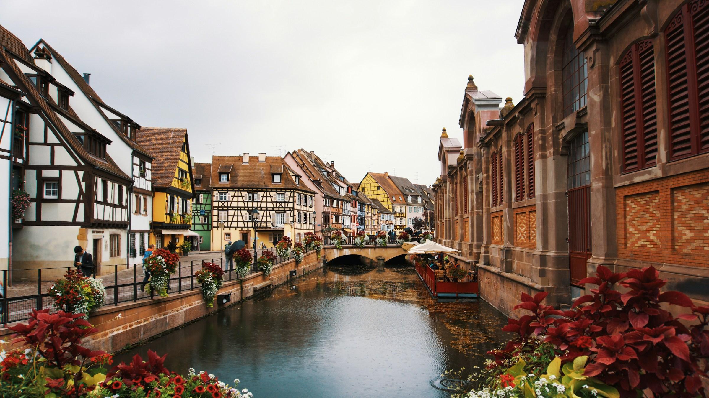 A canal in Colmar, France, lined with half-timbered houses