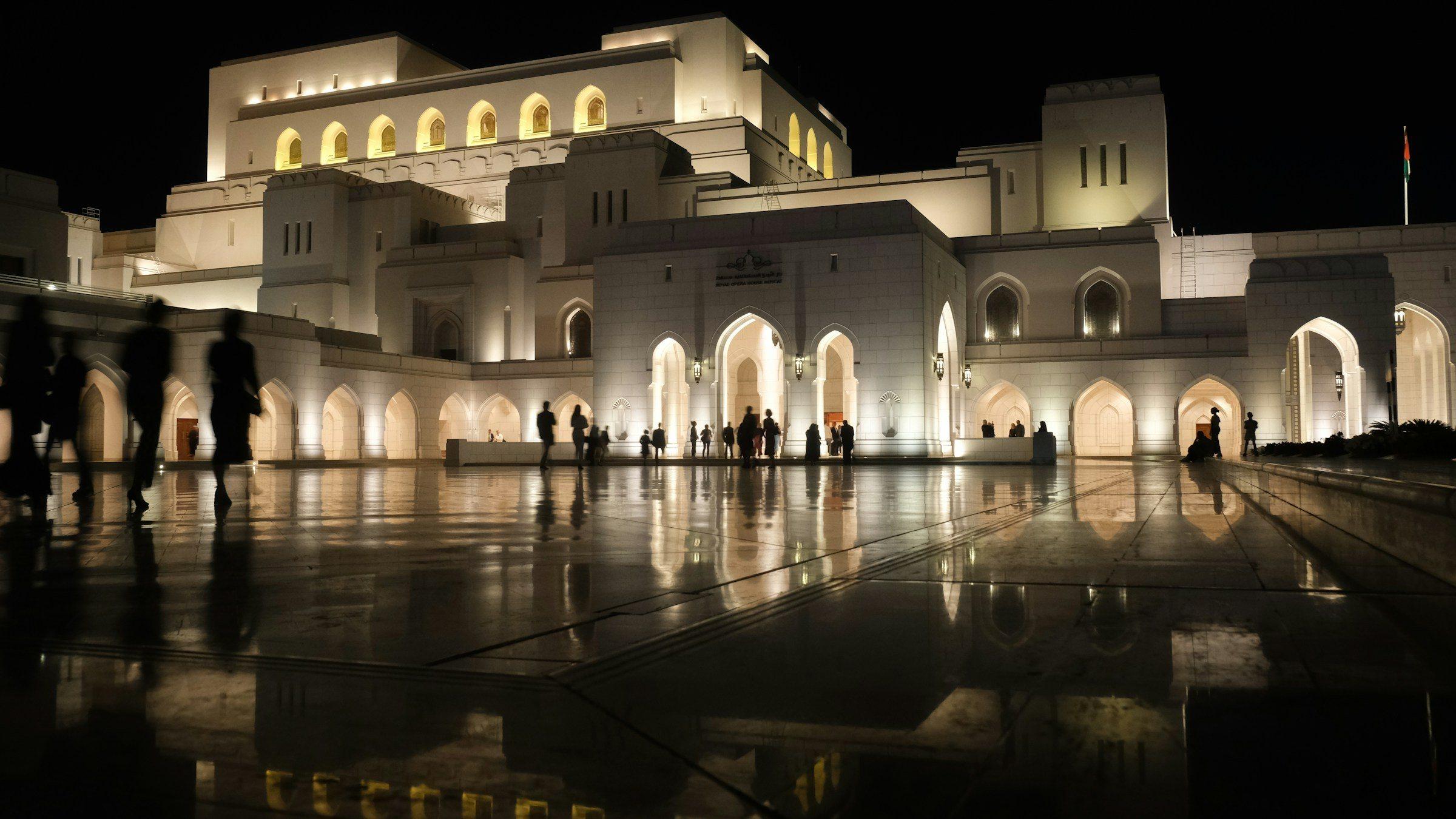 The Royal Opera House Muscat lit up at night