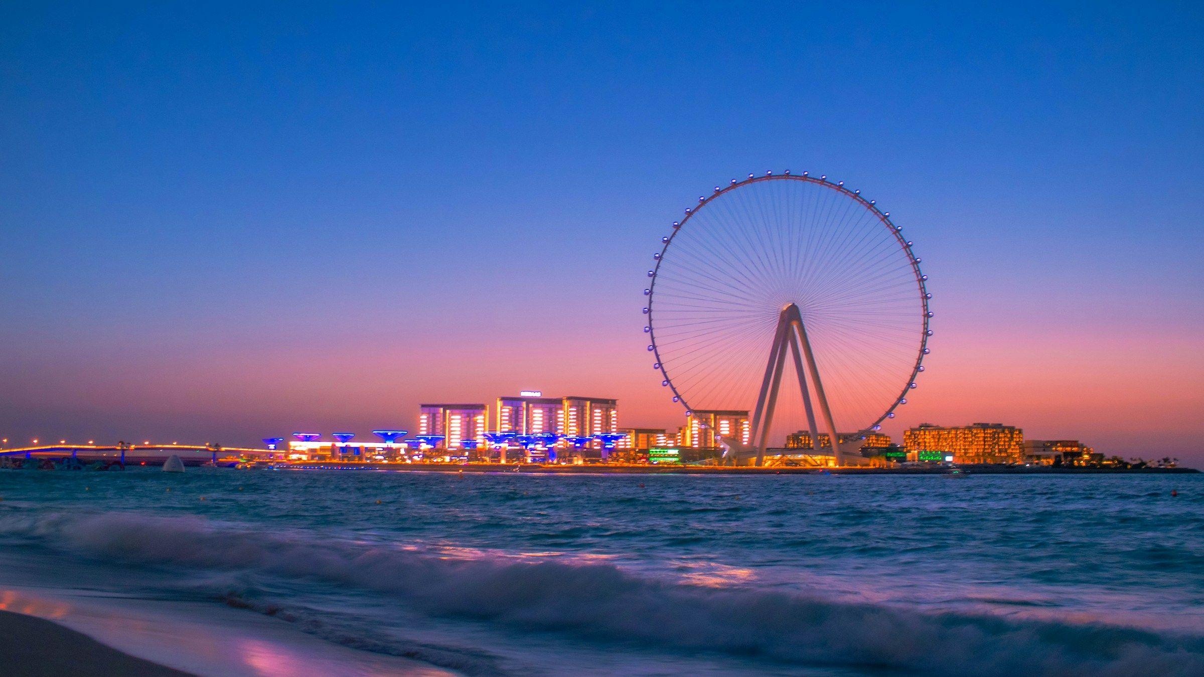 Ain Dubai, the observation wheel on Bluewaters Island, lit up at dusk