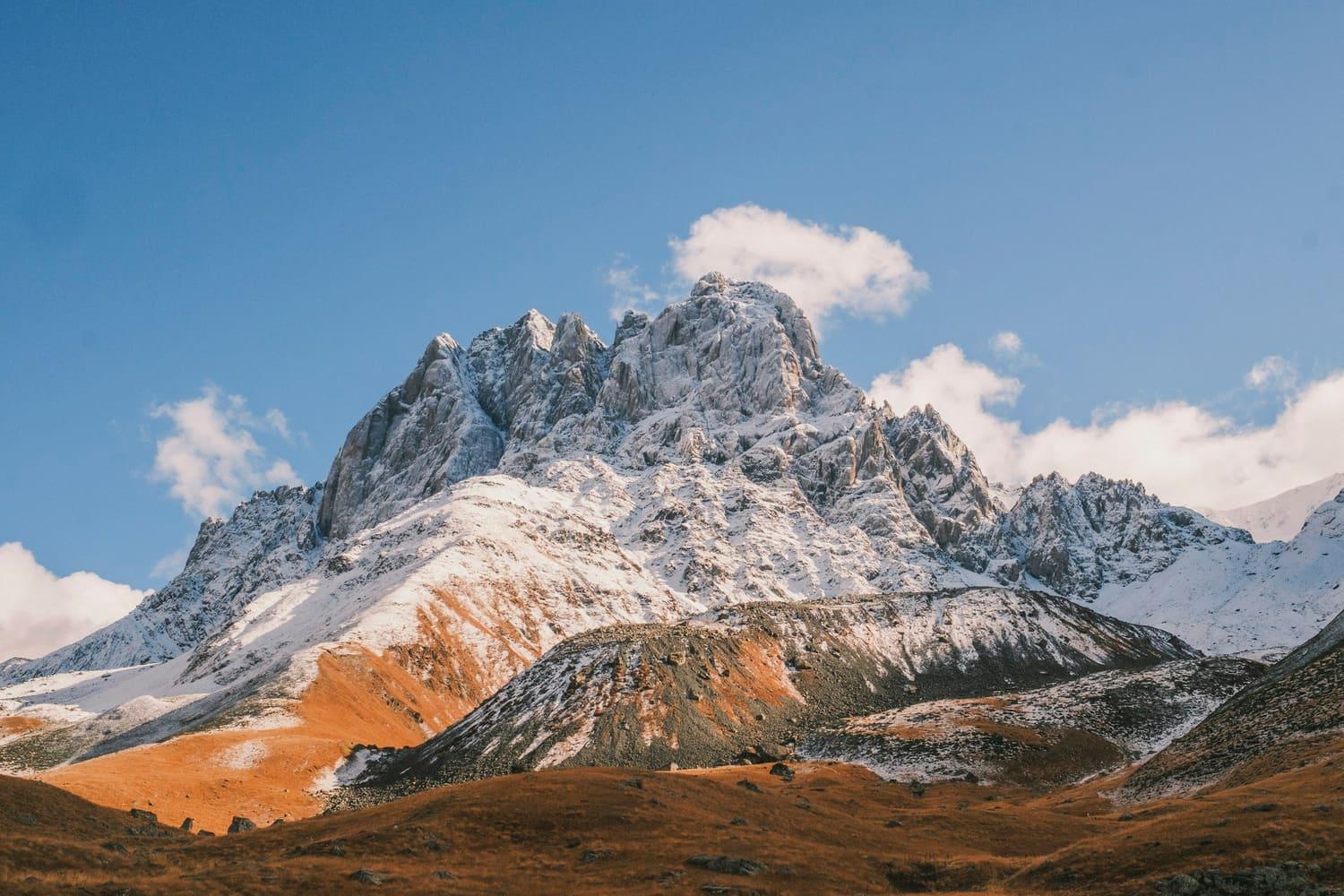 The snow-dusted Chaukhi massif above the Juta valley in autumn