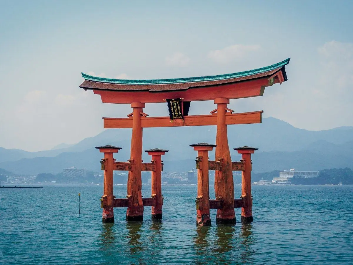 The torii gate of Itsukushima Shrine standing in the sea off Miyajima