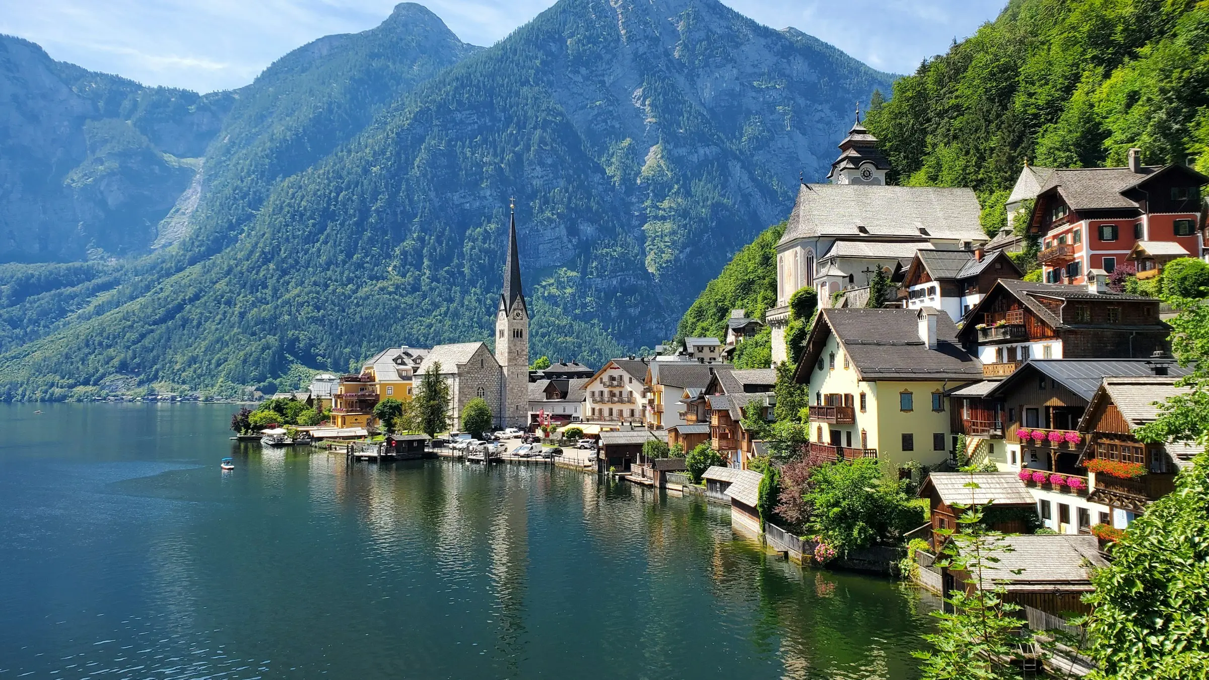 Hallstatt's lakeside houses and church below the Alps