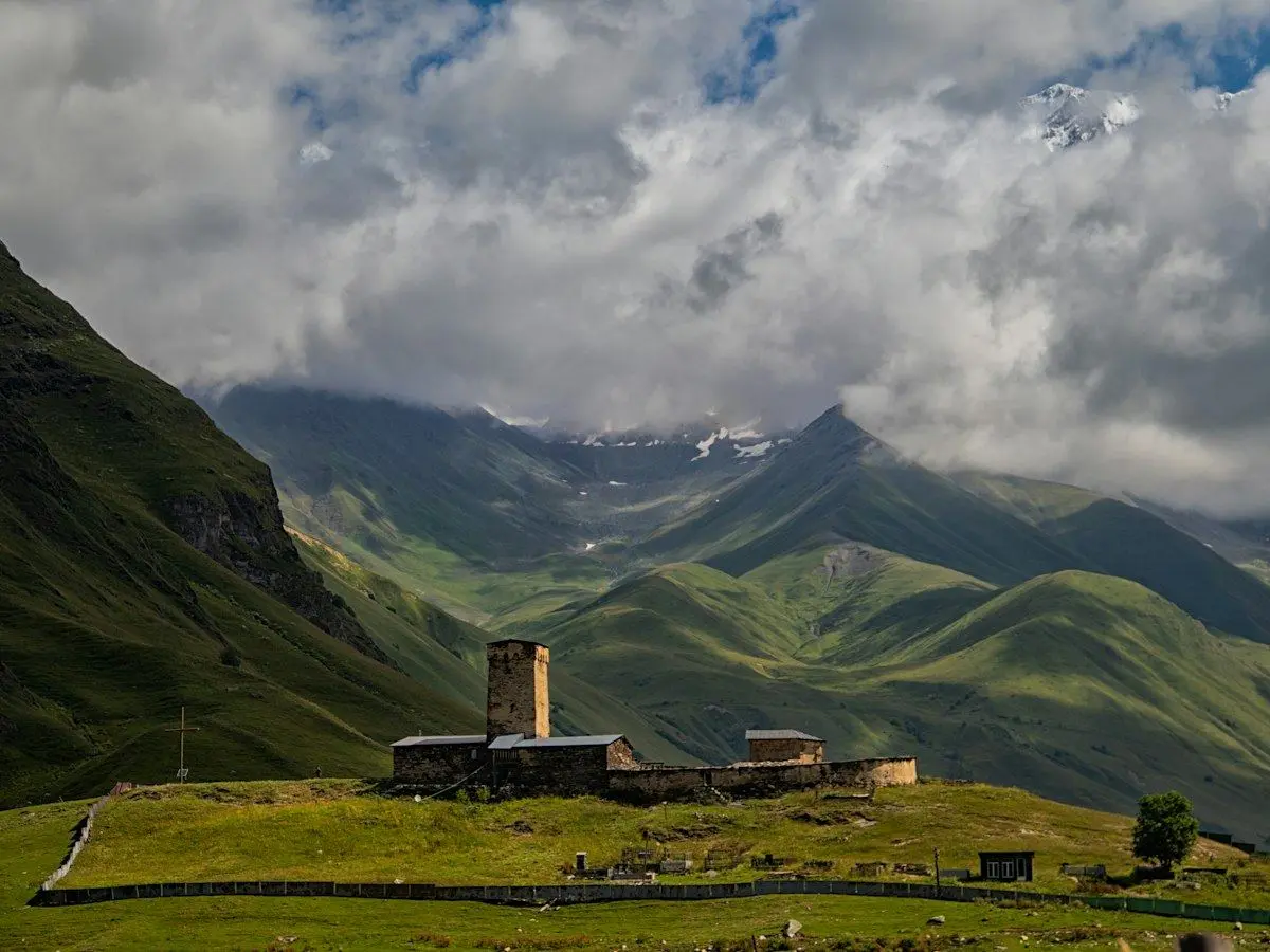Ushguli village and a defensive tower below the mountains of Svaneti