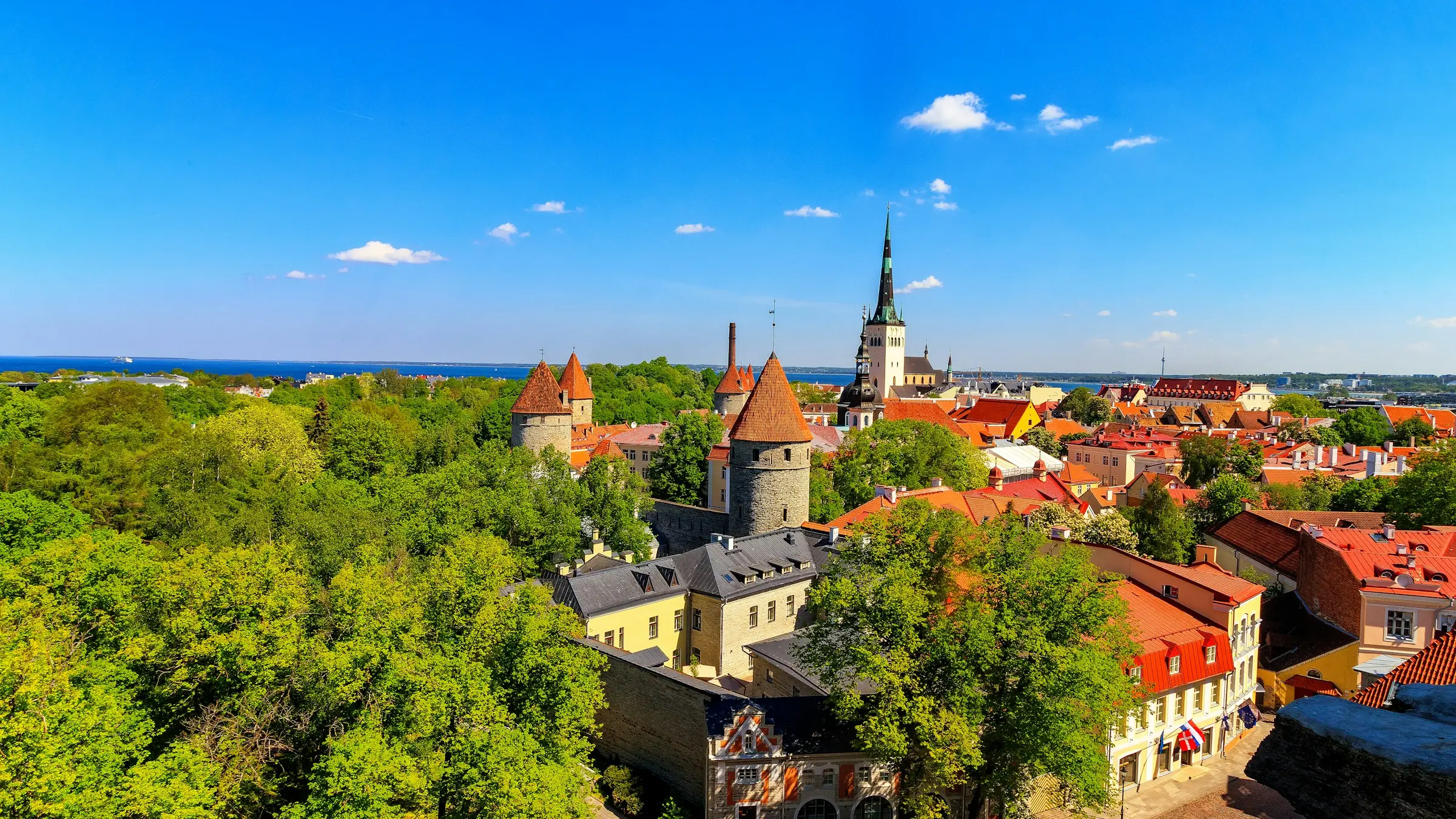 Tallinn's Old Town towers and the spire of St Olaf's Church, with the Baltic Sea behind