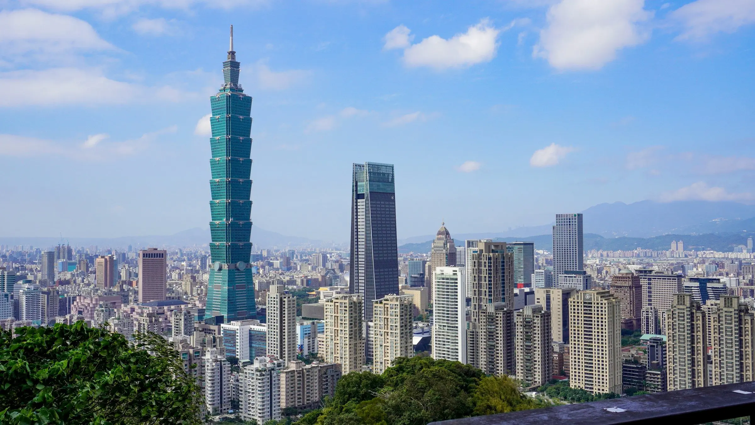 Taipei 101 rising above the city, seen from the hills