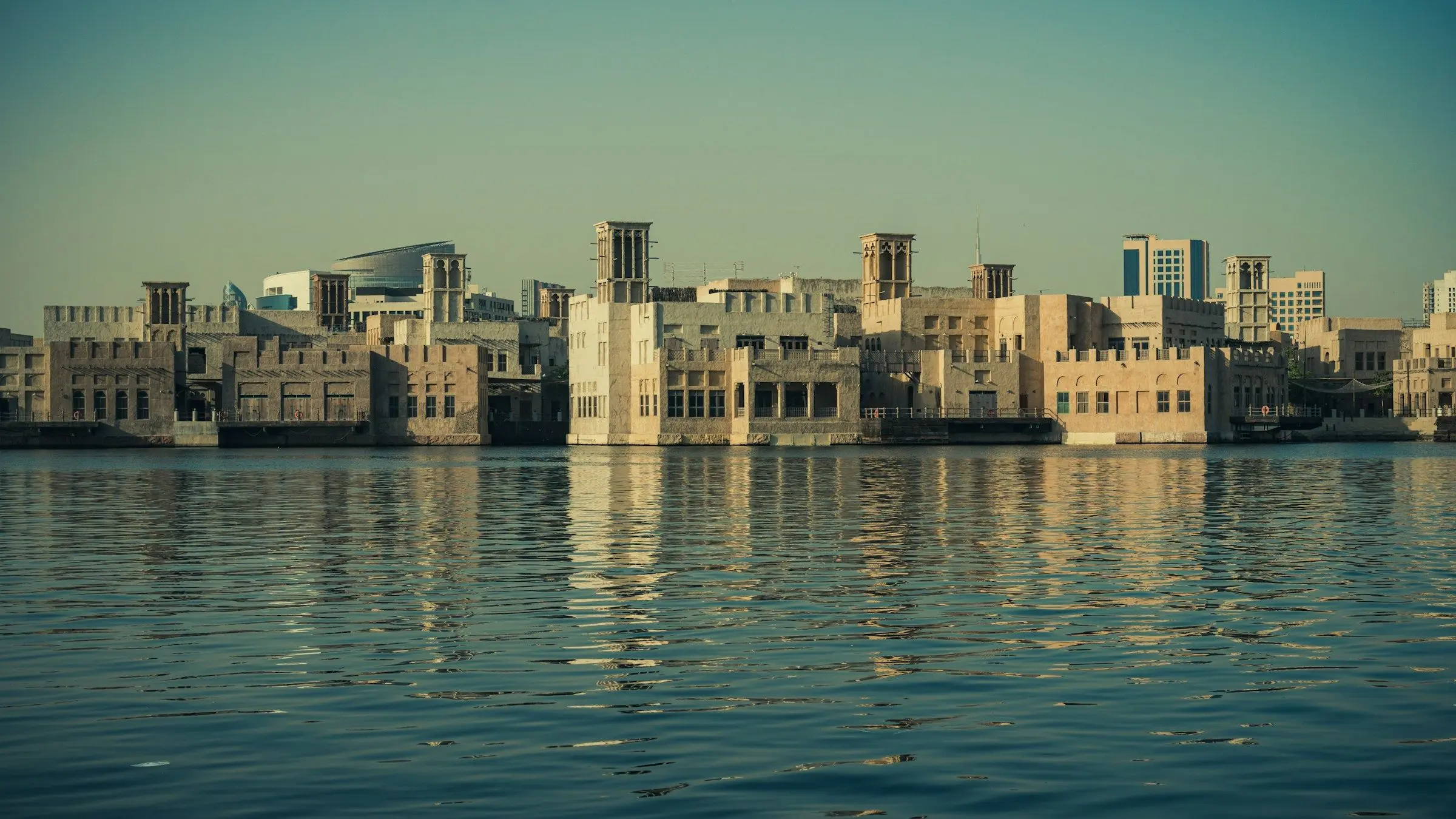 Wind-tower houses of old Dubai reflected in Dubai Creek