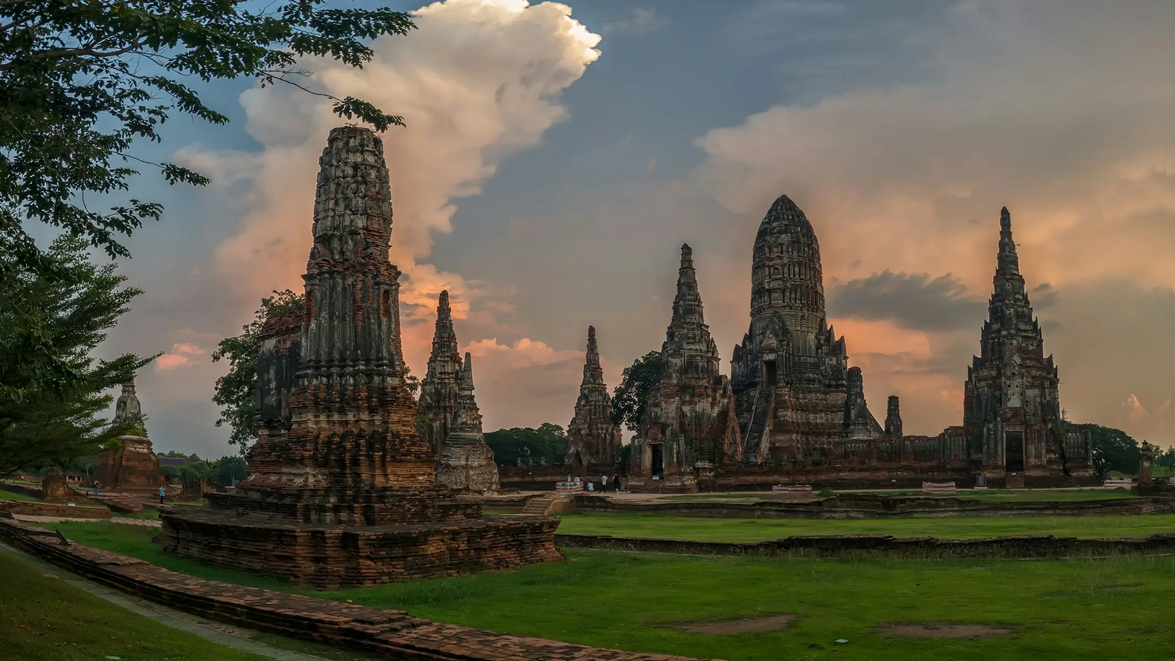 The prangs of Wat Chaiwatthanaram in Ayutthaya under a cloudy sky