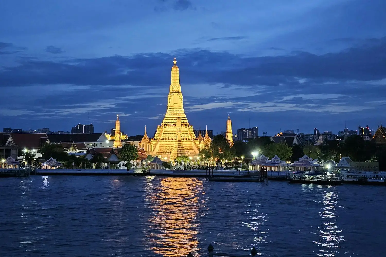 Wat Arun on the Chao Phraya river at sunset, Bangkok