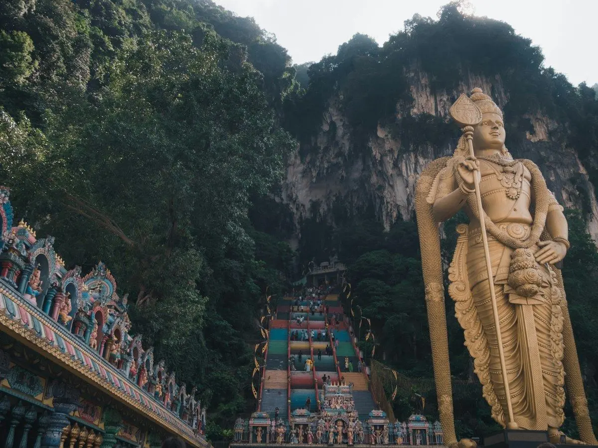 The golden statue of Lord Murugan at the entrance to Batu Caves