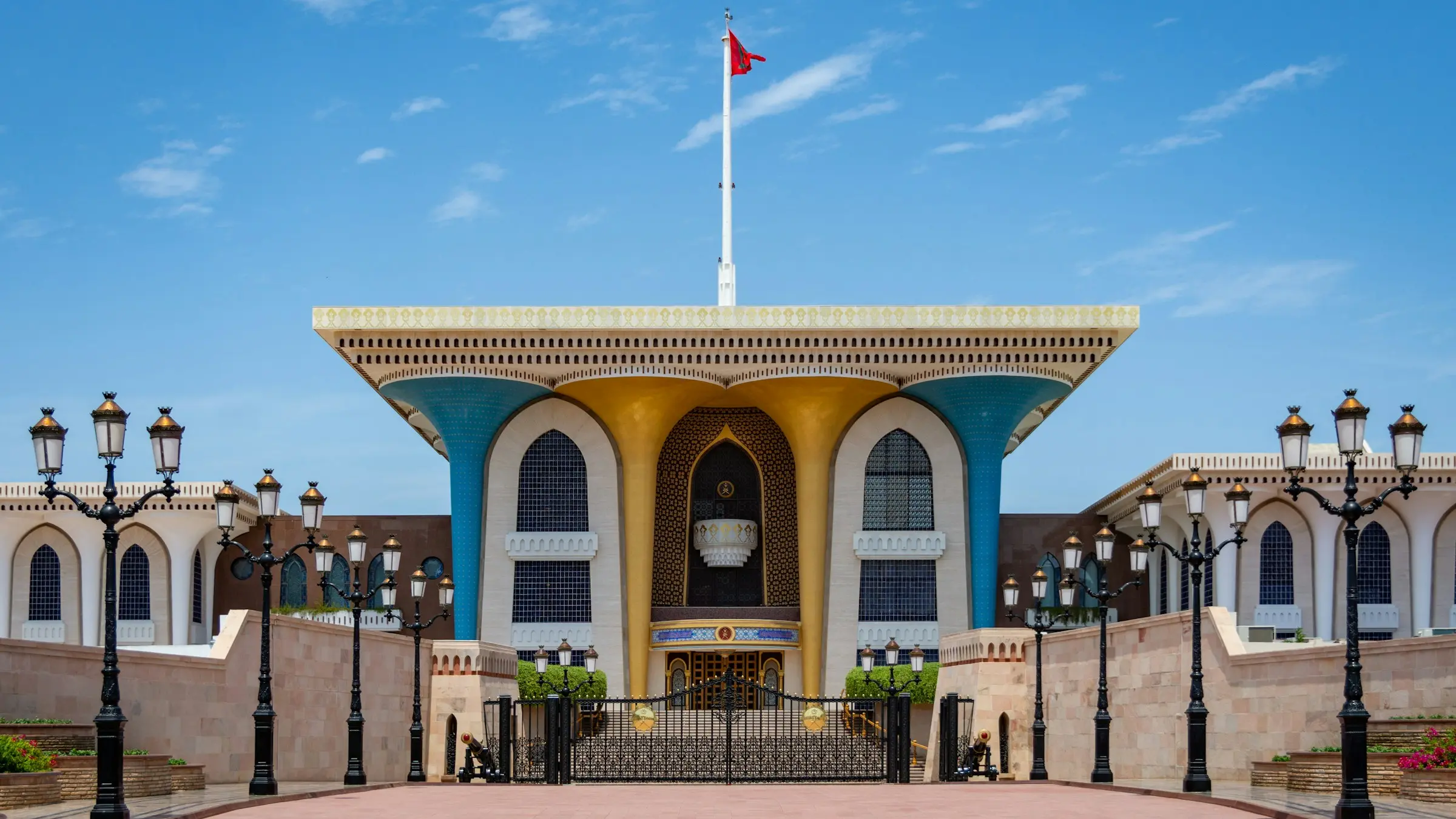 The blue and gold facade of Al Alam Palace in Muscat
