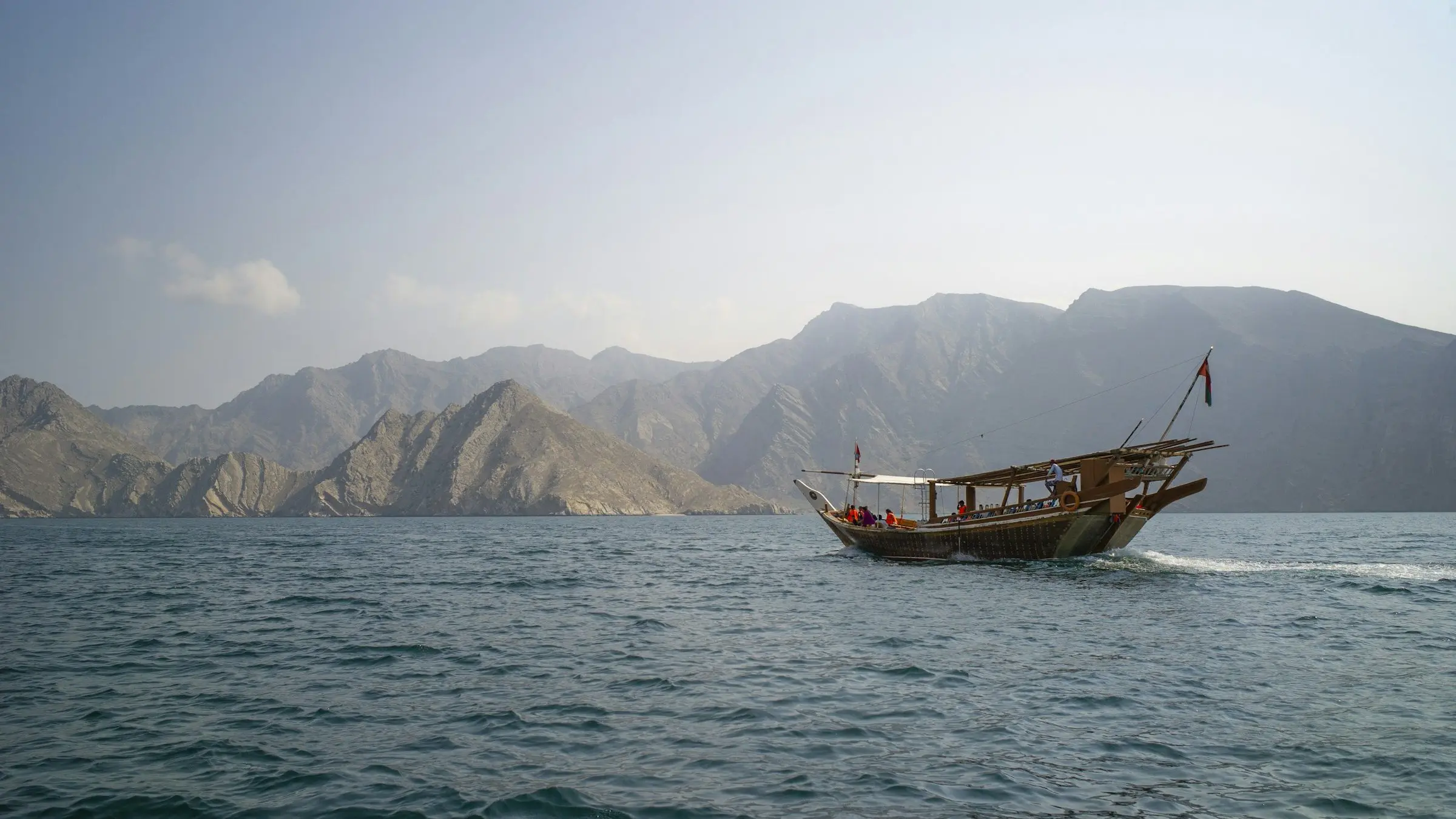An Omani dhow sailing the fjords of Musandam, Oman