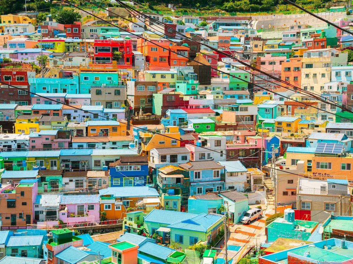 Brightly painted houses stacked on the hillside of Gamcheon Culture Village in Busan