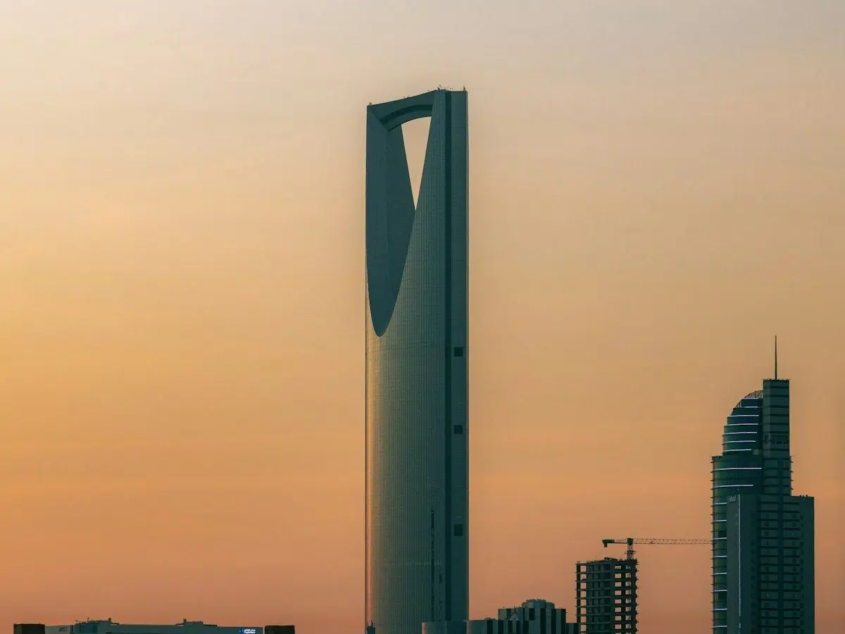 Kingdom Centre tower in Riyadh against an orange sky