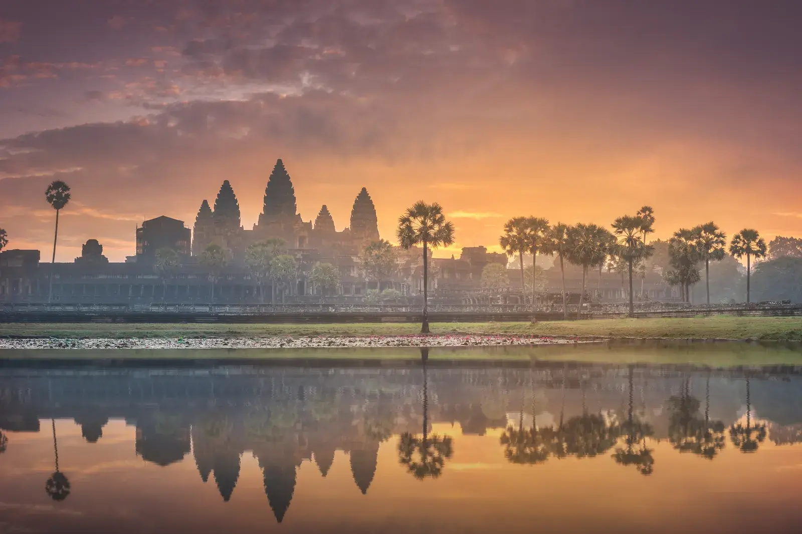 Angkor Wat at sunrise, reflected in the moat