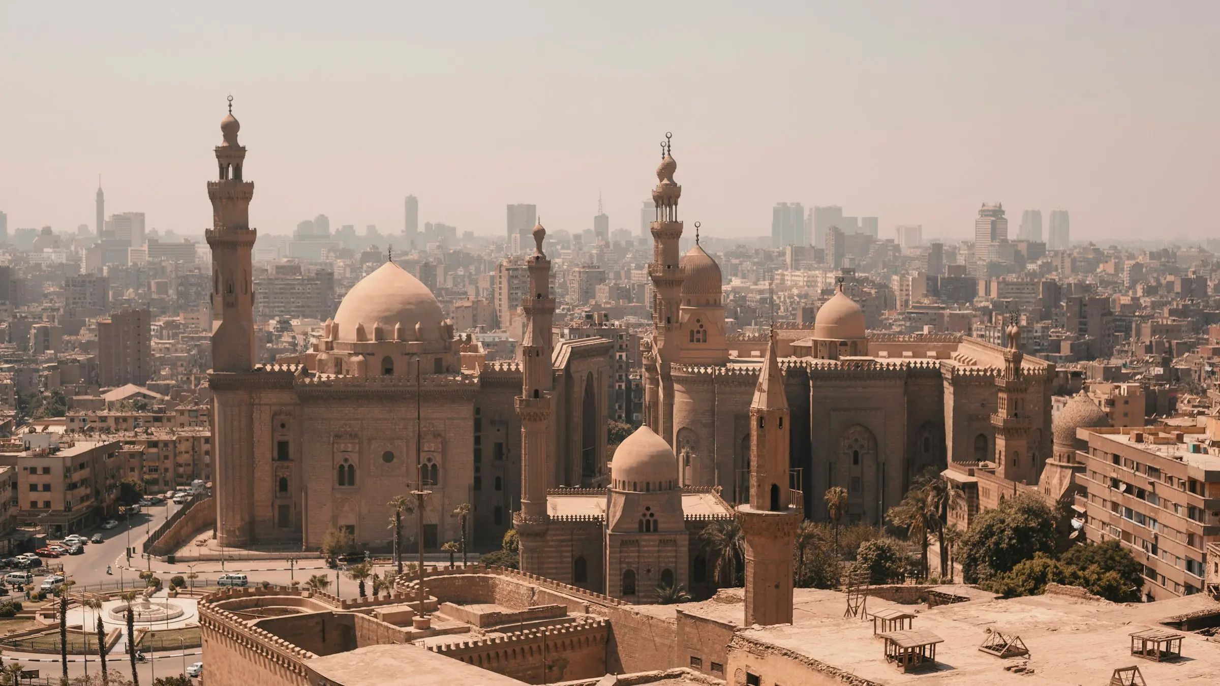 The Sultan Hassan and Al-Rifai mosques above the rooftops of Cairo
