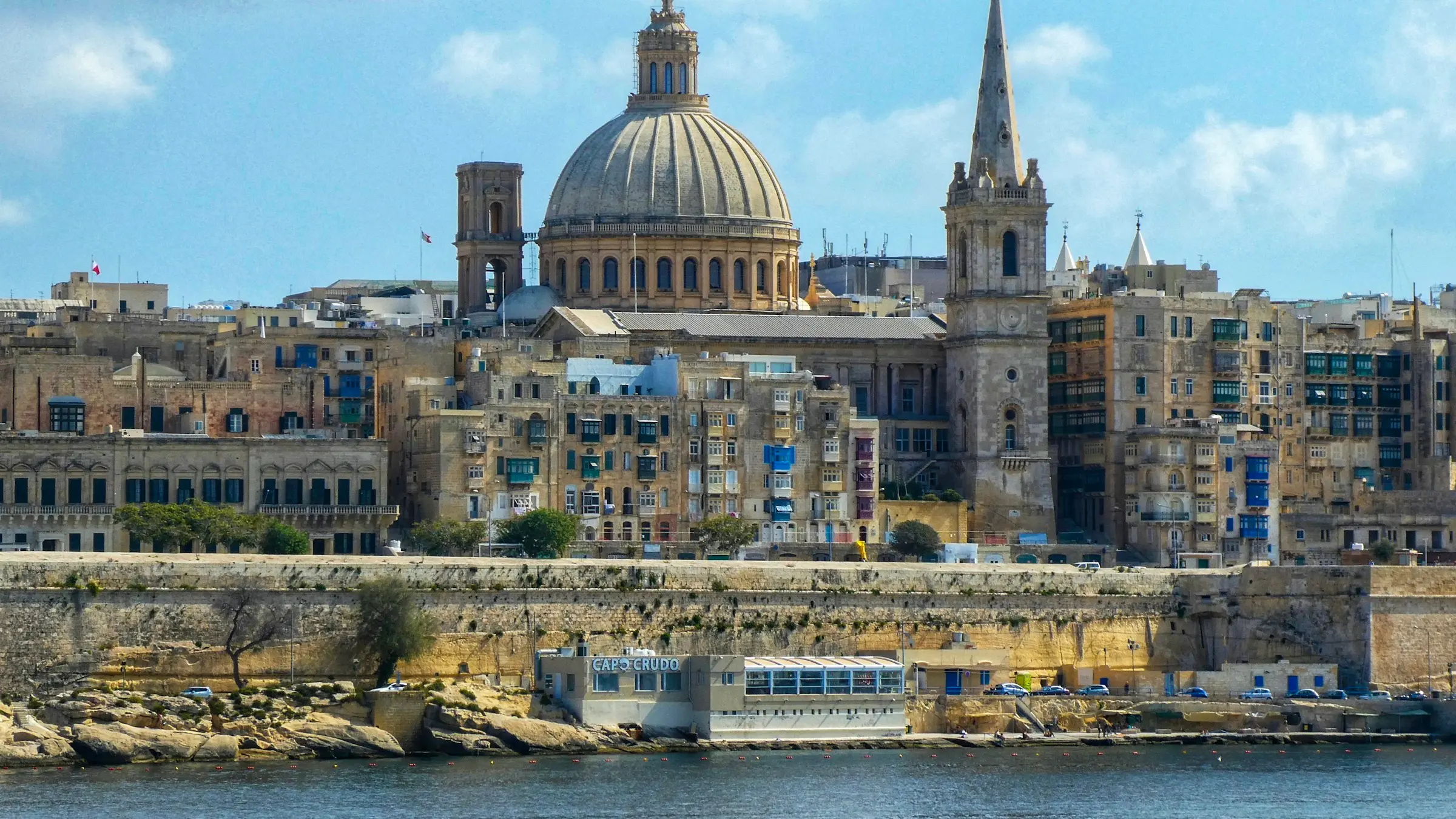 Valletta's skyline and dome seen across the harbour