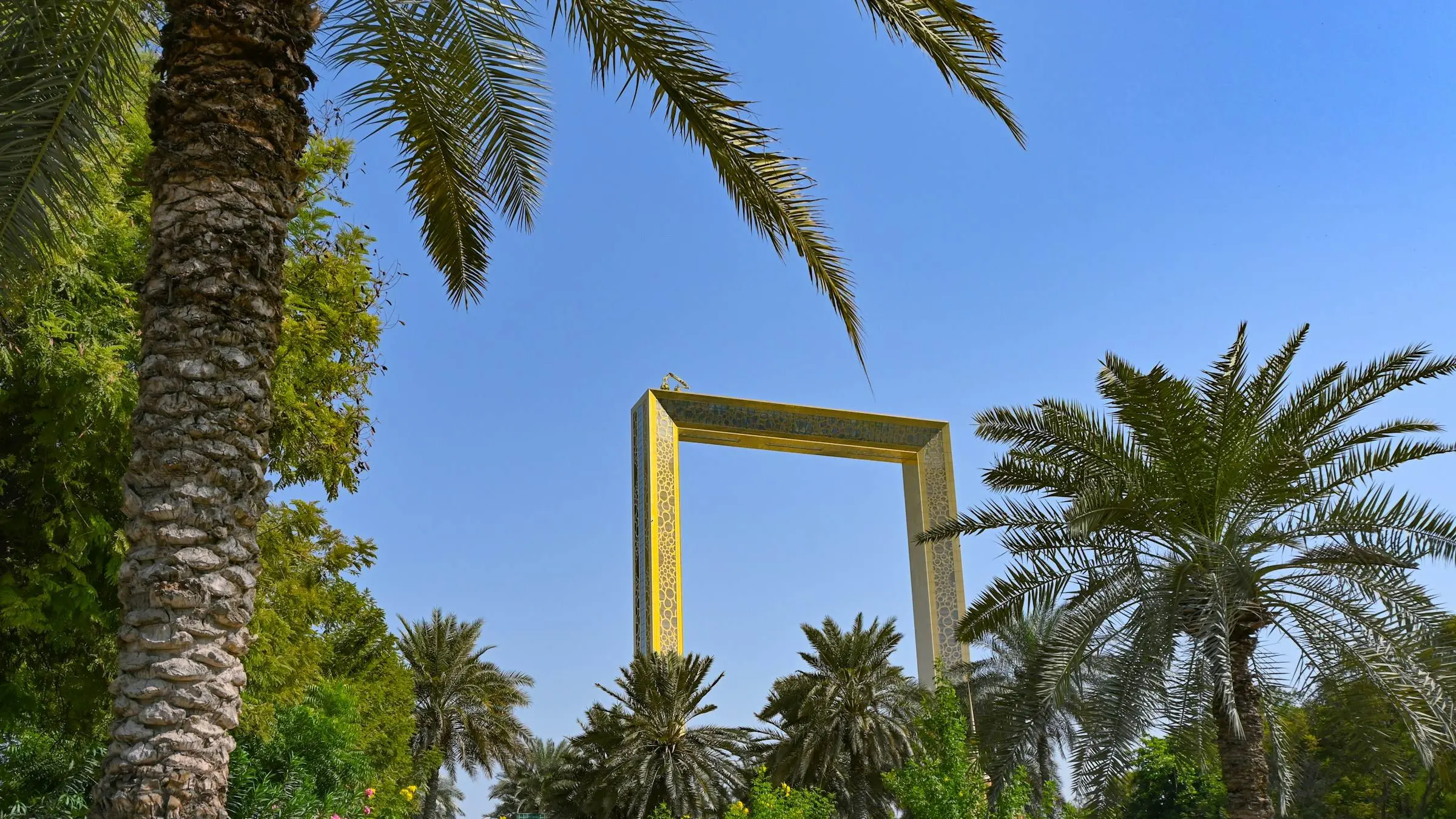 The Dubai Frame in Zabeel Park, seen between palm trees