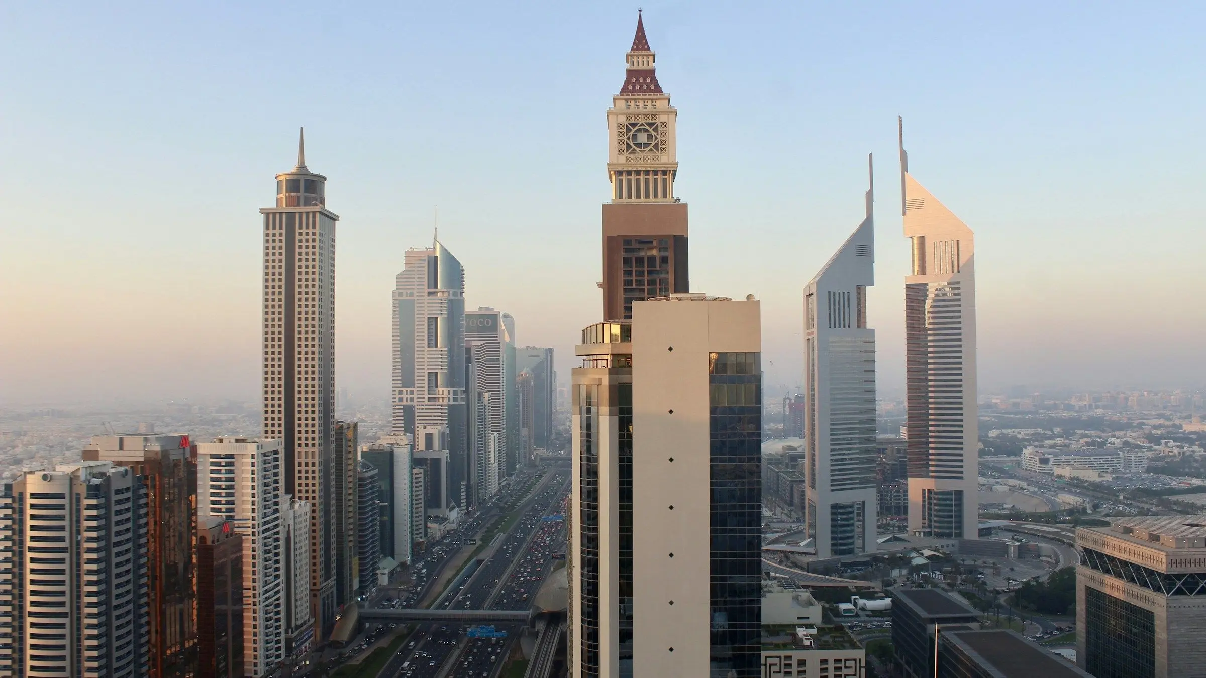 Office and hotel towers along Sheikh Zayed Road in Dubai at golden hour