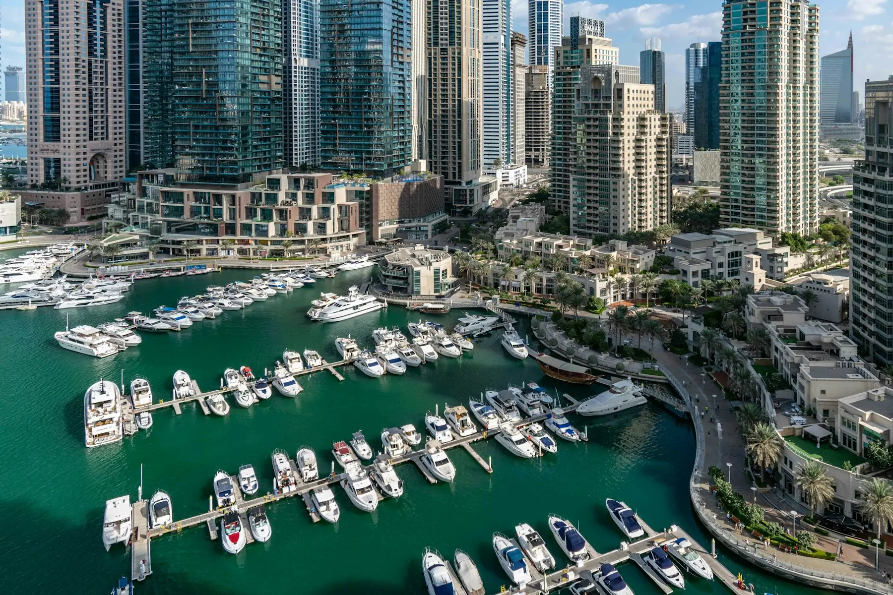 Yachts in Dubai Marina, with the Marina Walk promenade along the water